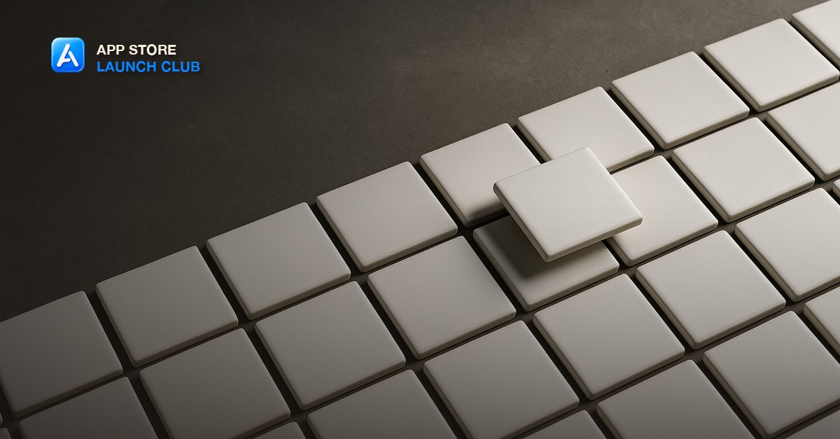 Dozens of identical plain white ceramic tiles arranged in a grid with a single tile lifted above the rest